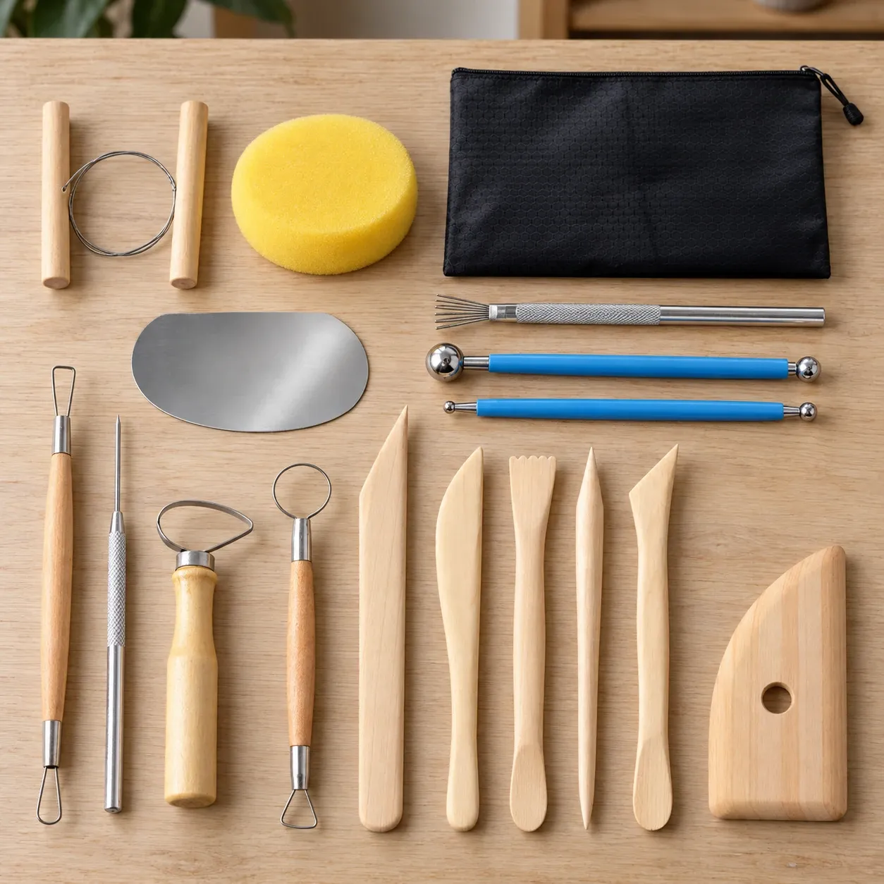 Iris Pottery Tools, complete seventeen-piece set with black pouch and yellow sponge